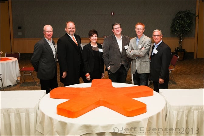 MarketStar executives with asterisk cake